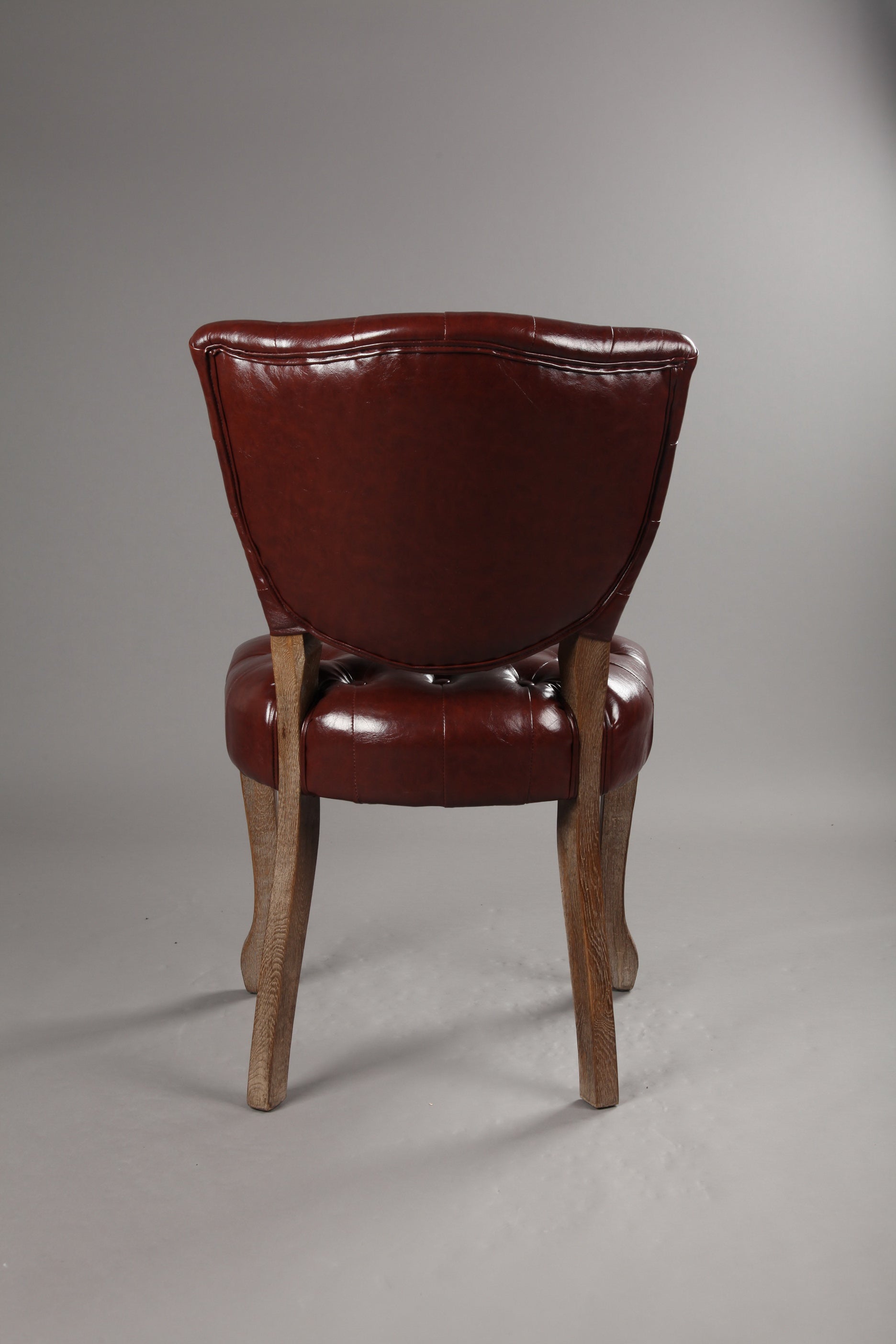 C-05-SITMOD Vintage Tufted Leather Dining Chair: Classic Button Detail, Solid Wood Legs, Elegant Style for Dining Room & Home Decor