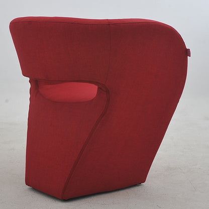 Vibrant Red Modern Hollow-Out Arm Chair Soft Contoured Fabric Seating Sleek Statement Piece for Stylish Living Rooms & Contemporary Spaces